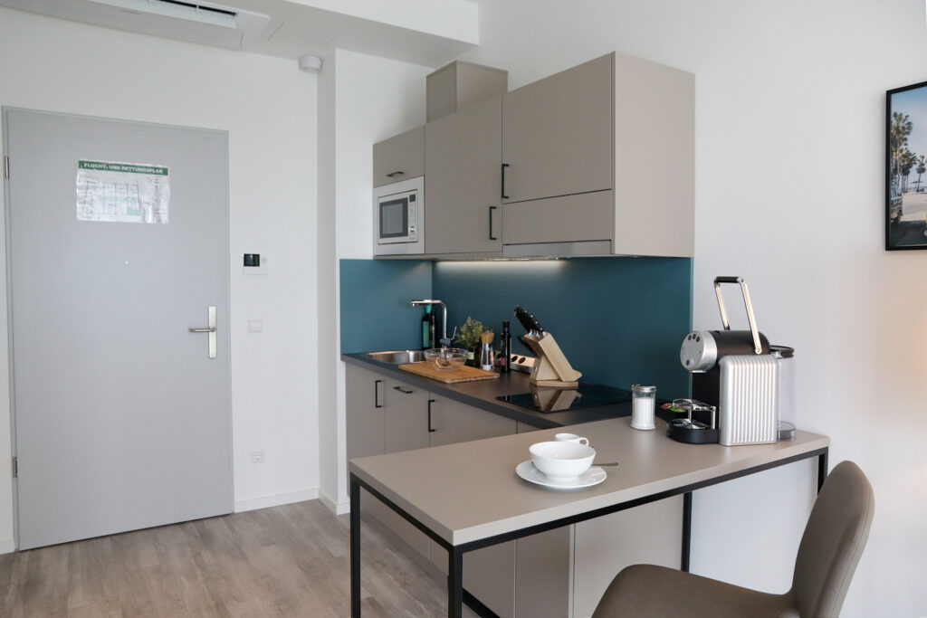 The kitchens in our PM-AM apartments are decorated with colorful accents.